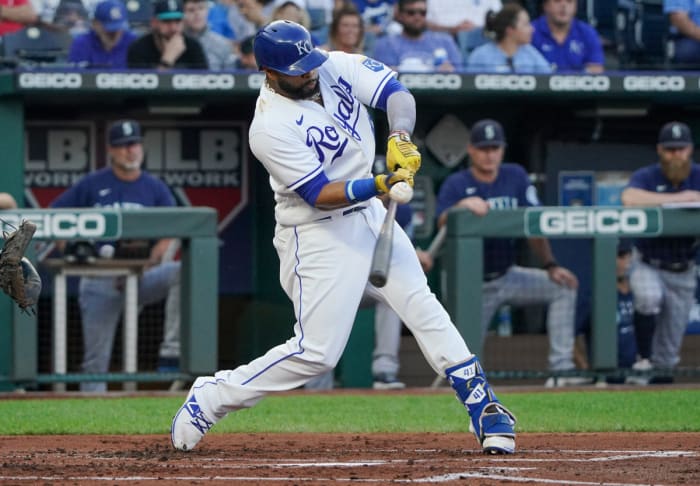 Sep 18, 2021; Kansas City, Missouri, USA; Kansas City Royals first baseman Carlos Santana (41) hits a single against the Seattle Mariners in the first inning at Kauffman Stadium. Mandatory Credit: Denny Medley-USA TODAY Sports